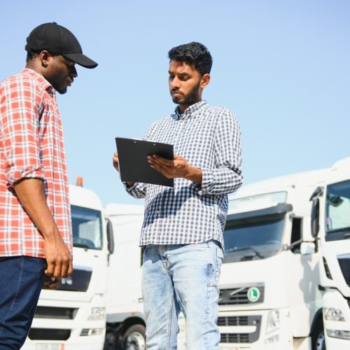 Logistics manager controlling truck driver schedule